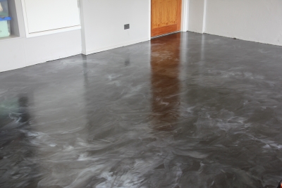 The residential garage after the silver metallic epoxy floor design was installed.